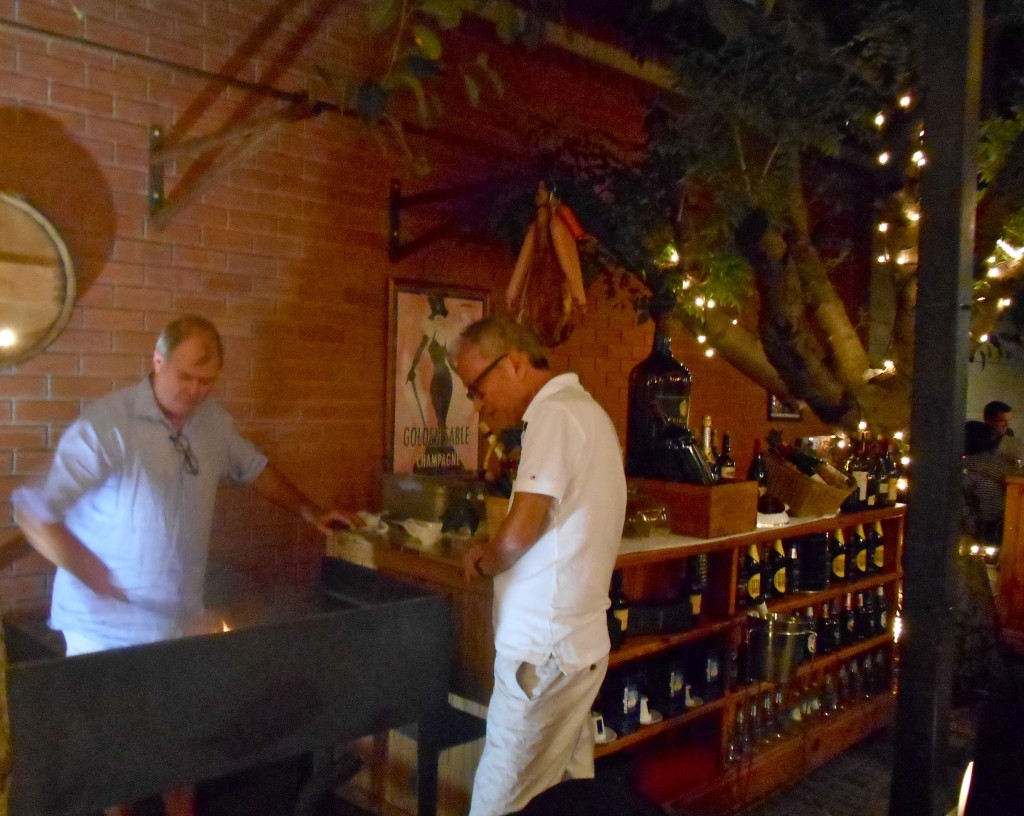 Dup the braaimaster does his stuff while an excited customer watches on